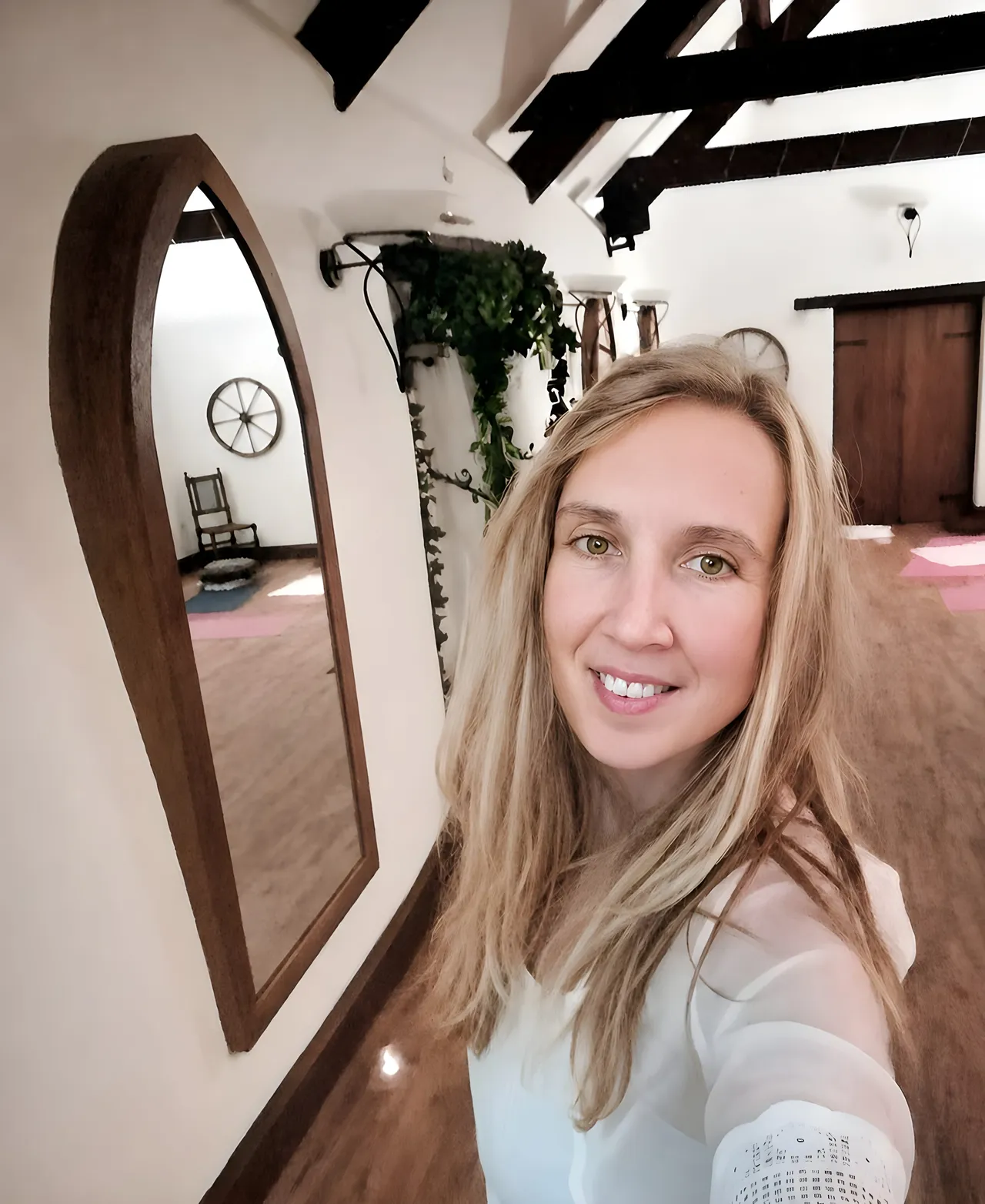 Maja, yoga Nidra teacher stood in a yoga studio